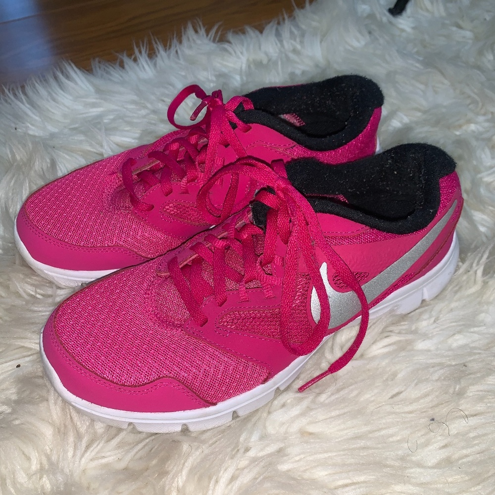 Pink and sliver Nike athletic shoes